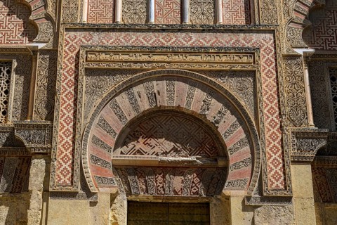 Córdoba Cathedral Mosque, Mezquita-Cathedral, Impressive arch of decorated sandstone with red and