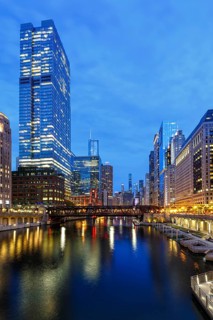 Skyline skyscrapers skyscrapers on the Chicago River bridge at night in Chicago, USA