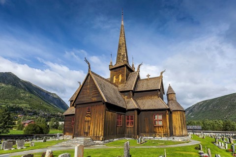 Lom Stave Church (Lom stavkyrkje) with cemetery in the foreground, Lom, Norway