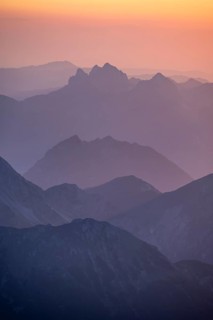 Silhouettes of mountains at sunset, view from the summit of the Zugspitze, Wetterstein Mountains,