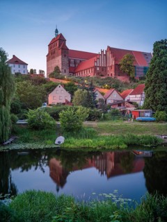 Havelberg Cathedral of St Mary at dusk, reflection in the moat, brick architecture, Hanseatic town
