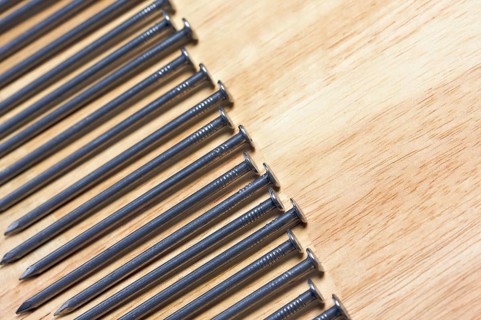 Macro of Nails on a Wood Background