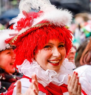 Colourfully costumed carnivalists celebrate carnival in Cologne, on Weiberfastnacht the street
