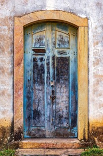 Carved wooden gate in an old baroque church in the city of Ouro Preto in Minas Gerais