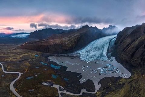 Stunning aerial shot capturing the expansive Vatnajökull Glacier winding through rugged mountains