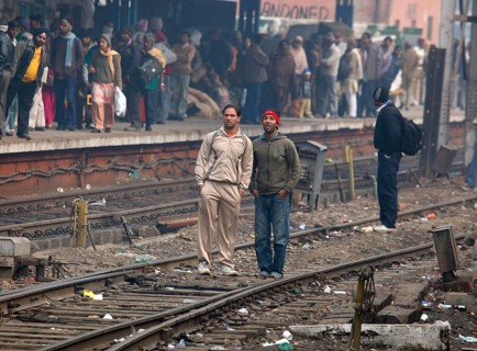 Neu Dehli, India, 15.01.10 - Railway Station in Neu-Dehl, passengers on the tracks, India