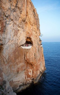 Cave in the rock used as a club, Cova den Xoroi, Menorca, Balearic Islands, Spain