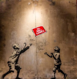 Banksy - No Ball Games, children obey and break the rules at the same time, 2009, Tottenham,