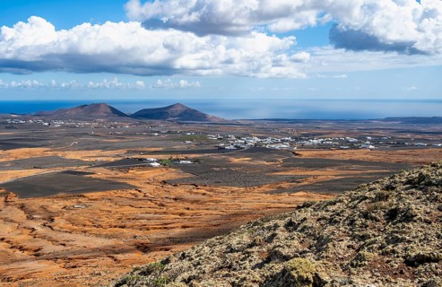View of dry volcanic landscape with fields, Lanzarote, Canary Islands, Spain
