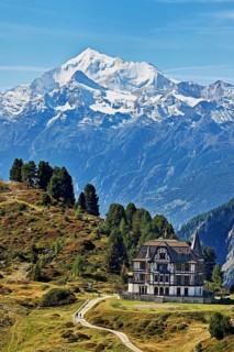 Pro Natura Centre Villa Cassel, snow-covered Alps in the background, Unesco World Heritage Site