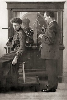 A patient being treated by Proffessor Wilhelm Conrad Röntgen with a direct spark treatment, an