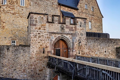 Castle wall with gate and bridge in medieval style, robust and fortified, The gate of Spangenberg
