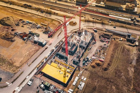 Construction near roads and railways, with significant use of cranes and materials, new Mühlacker