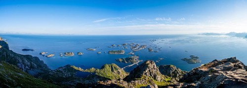 Panorama, view of the sea with numerous small rocky islands with houses, at the summit of