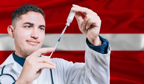Doctor holding syringe on Latvia flag background. Medical professional holding syringe with Latvian