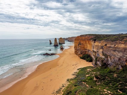 Breathtaking coastal scene featuring towering cliffs and striking sea stacks in the Twelve