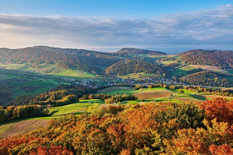 View from the Gisliflue of an autumnal forest with the Jura foothills behind, Talheim, Canton,