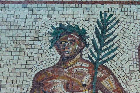 Mosaic depiction of a figure with palm tree, consisting of colorful stones, Museum of the History
