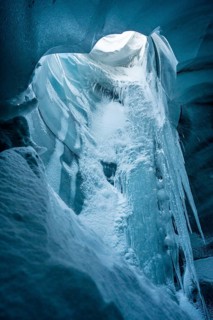 A stunning beauty of an ice cave within Katla Glacier, Iceland, captured in winter. The icy