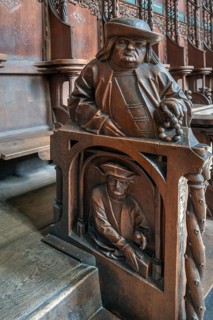 Figures on the late Gothic choir stalls from 1507, St Martin, Memmingen, Bavaria, Germany
