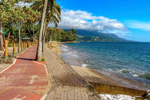 Bike path along the sea in the city of Ilhabela in Sao Paulo, Brazil