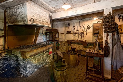Workshop of a smithy, historical smithy from Selters, inside, Hessenpark Open-Air Museum,