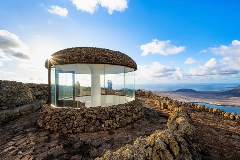 Stairway and viewing platform at the Mirador del Río viewpoint, in the evening light with sun