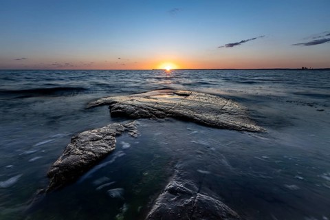 Rocks in the sea at sunset at Trönninge Stranden, Halmstad, Sweden
