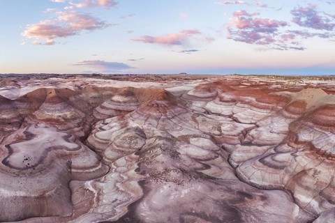 Stunning aerial shot capturing the unique patterns and vibrant earth tones of bentonite landscapes