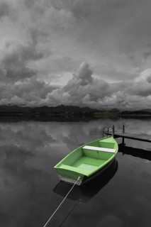 Storm clouds at sunset, a green rowing boat lashed to the wooden jetty, Hopfensee, Hopfen am See,