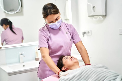 A skilled practitioner provides a soothing massage to a client in a modern beauty salon. The