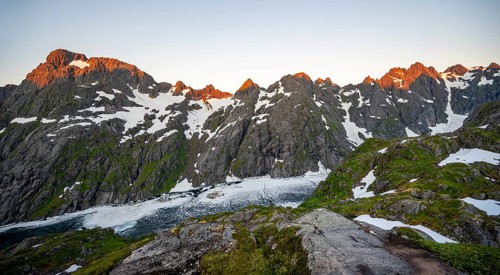 Rocky mountain peaks and Trollfjordvatnet with snow, at the Trollfjord Hytta, mountain landscape