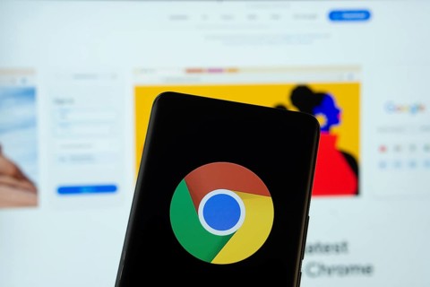 Chrome logo is displayed on a smartphone screen, with the chrome website visible on a computer