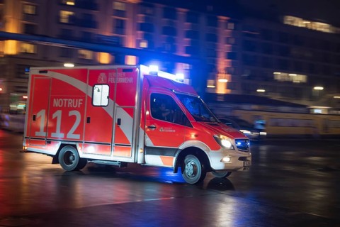 BERLIN, GERMANY - JANUARY 1, 2019: Fire brigade drives on streets crossing during New Year Eve