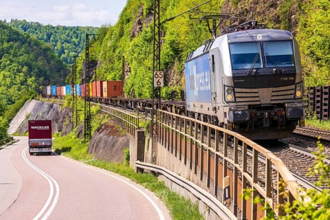 Goods train travelling on the winding Geislinger Steige railway line. Landscape along the railway