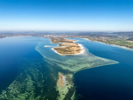 Aerial view of the Mettnau peninsula at low tide with shallows, danger to shipping traffic,