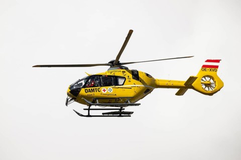 Rescue helicopter, emergency helicopter in flight, Schwaz, Tyrol, Austria