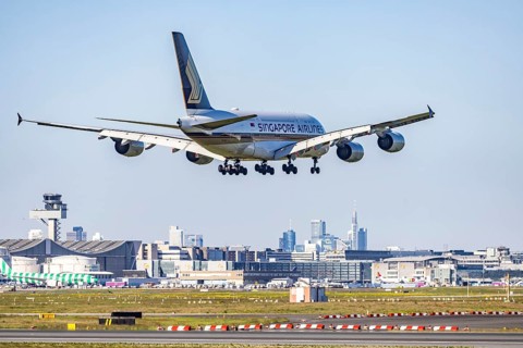 Fraport Airport in Frankfurt am Main. Aircraft landing against the backdrop of the banking district
