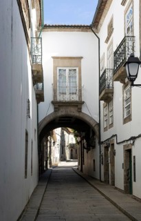 Narrow medieval street Rua de Santa Maria, city centre of Guimaraes, northern Portugal