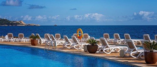 Swimming pool and sun loungers, Cala Rajada, Majorca, Spain