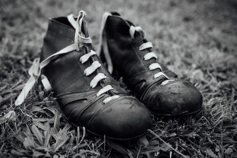 Vintage football boots on grass