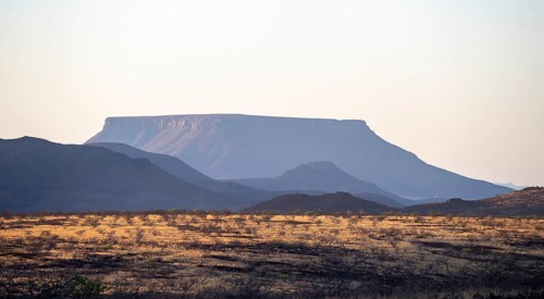 Table Mountain in the morning light at sunrise, barren dry desert landscape near Palmwag,