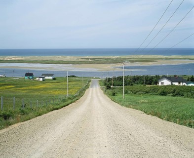 Steep gravel road on Grosse Ile in summer, Magdalen Islands, Quebec, Canada