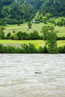 River Inn bursting its banks during a flood in the area of Prutz, Tyrol, Austria