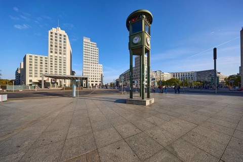 Replica and monument of the first traffic lights and modern office building at Potsdamer Platz in
