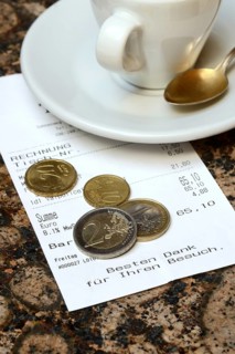 Tip, euro coins with receipt