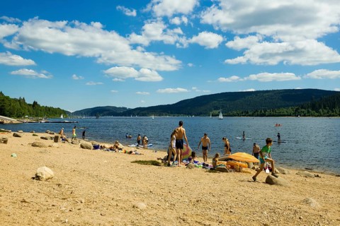Lake in the mountains and beach in summer, Schluchsee, Black Forest, Baden-Württemberg, Germany