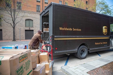 New Orleans, Louisiana - A United Parcel Service driver loads packages into his 'package car' at