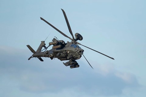 Agusta Westland AH-64 Apache helicopter aircraft in British Army air corps colours flying, England,