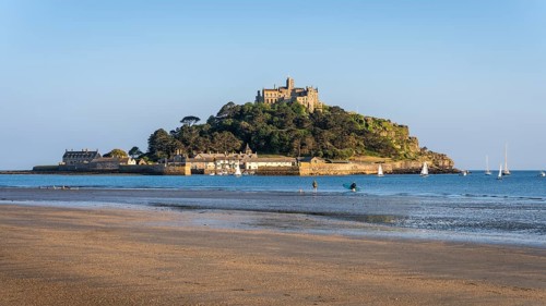 View of St Michaels Mount, from Marazion Beach. Evening, golden hour. St Michael's Mount, Marazion,